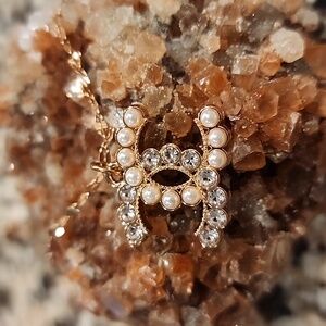 Authentic Chanel upscaled pearl and rhinestone tag pendant